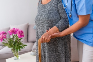 Medical professional helping someone.