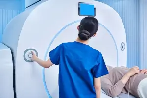 medical professional guiding patient through MRI