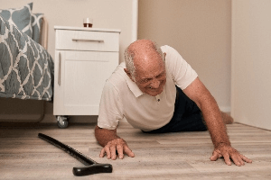 elderly man after falling on floor